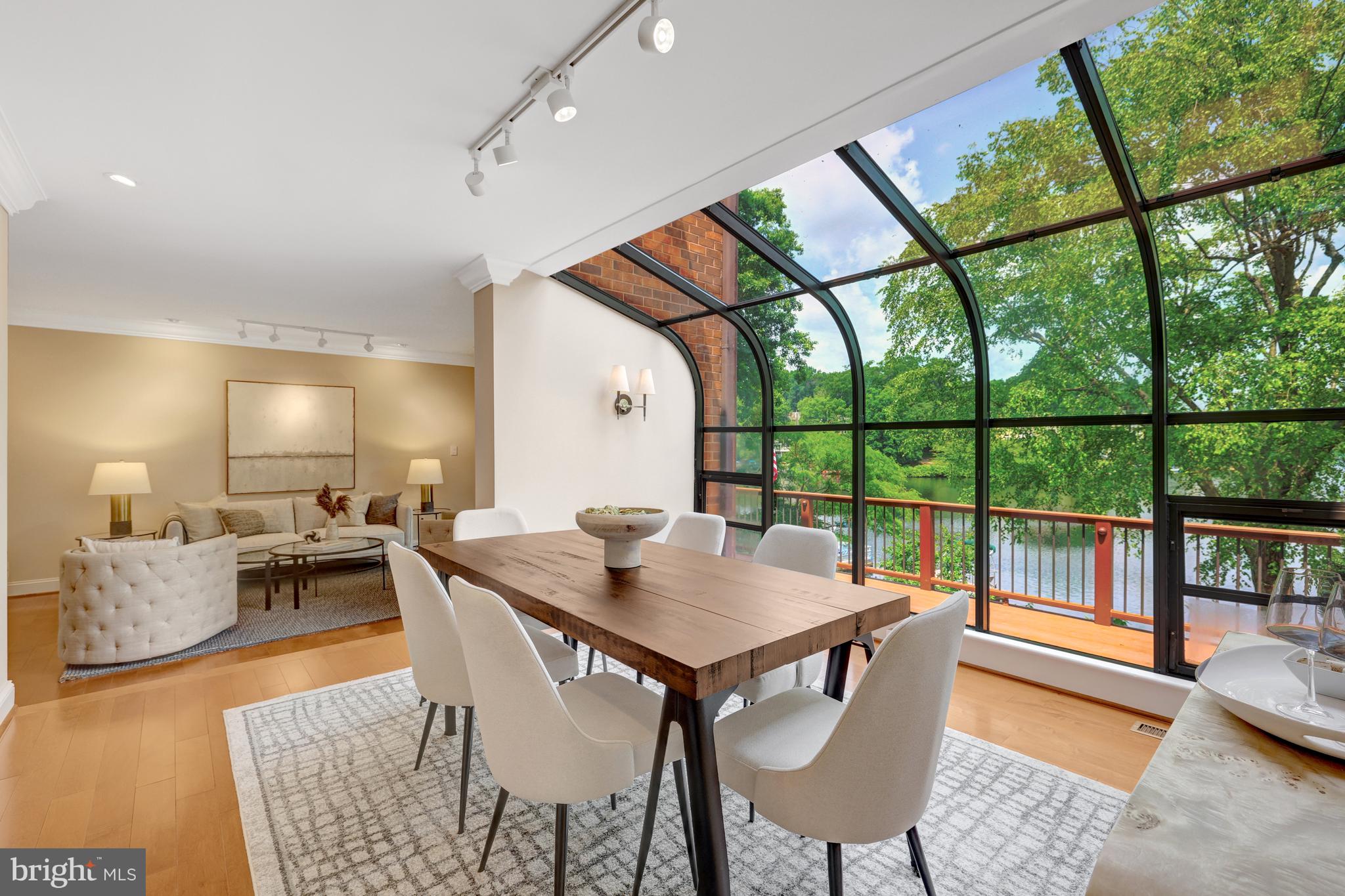 11064 Thrush Ridge Road Reston, VA 20191 - Photo 18 of 85 a view of a dining room with furniture wooden floor and a chandelier