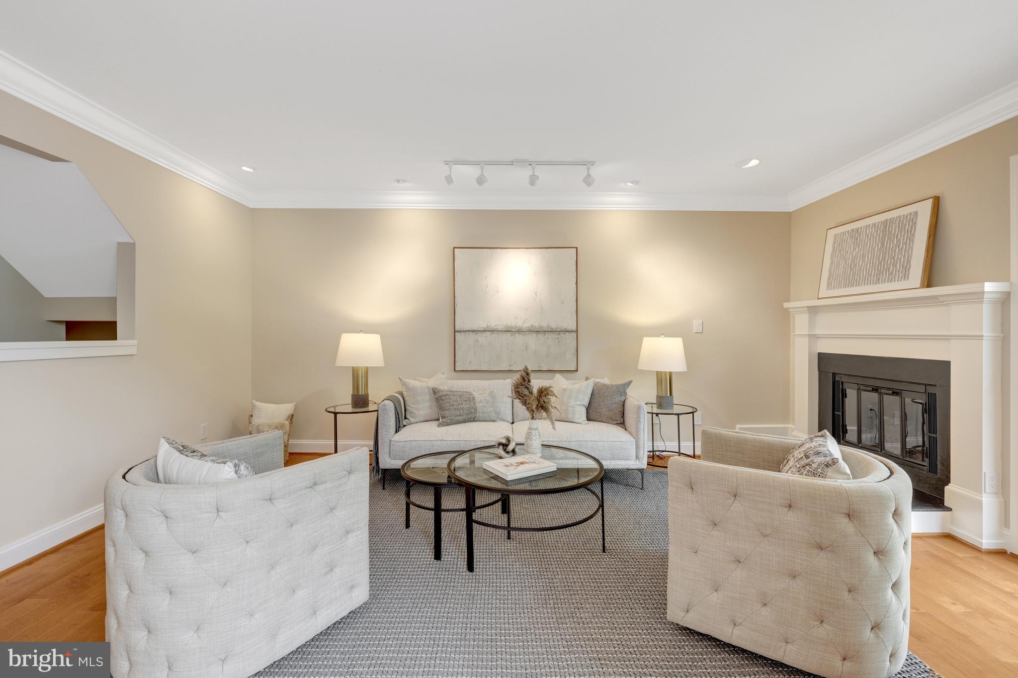 11064 Thrush Ridge Road Reston, VA 20191 - Photo 22 of 85 a living room with furniture and a fireplace