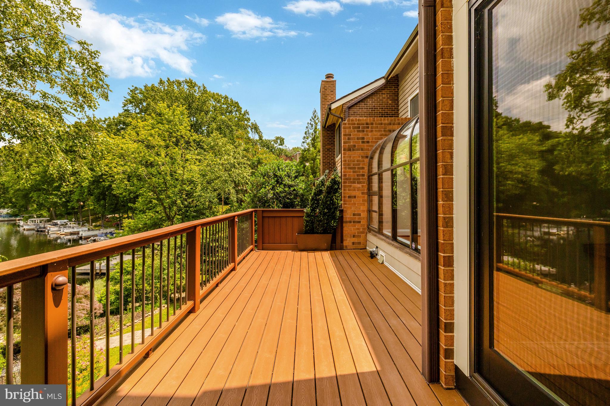 11064 Thrush Ridge Road Reston, VA 20191 - Photo 28 of 85 a view of balcony with a large window and wooden floor