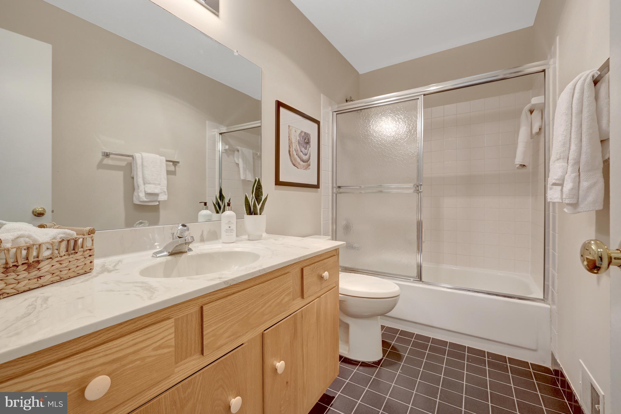 11064 Thrush Ridge Road Reston, VA 20191 - Photo 52 of 85 a bathroom with a sink toilet and shower