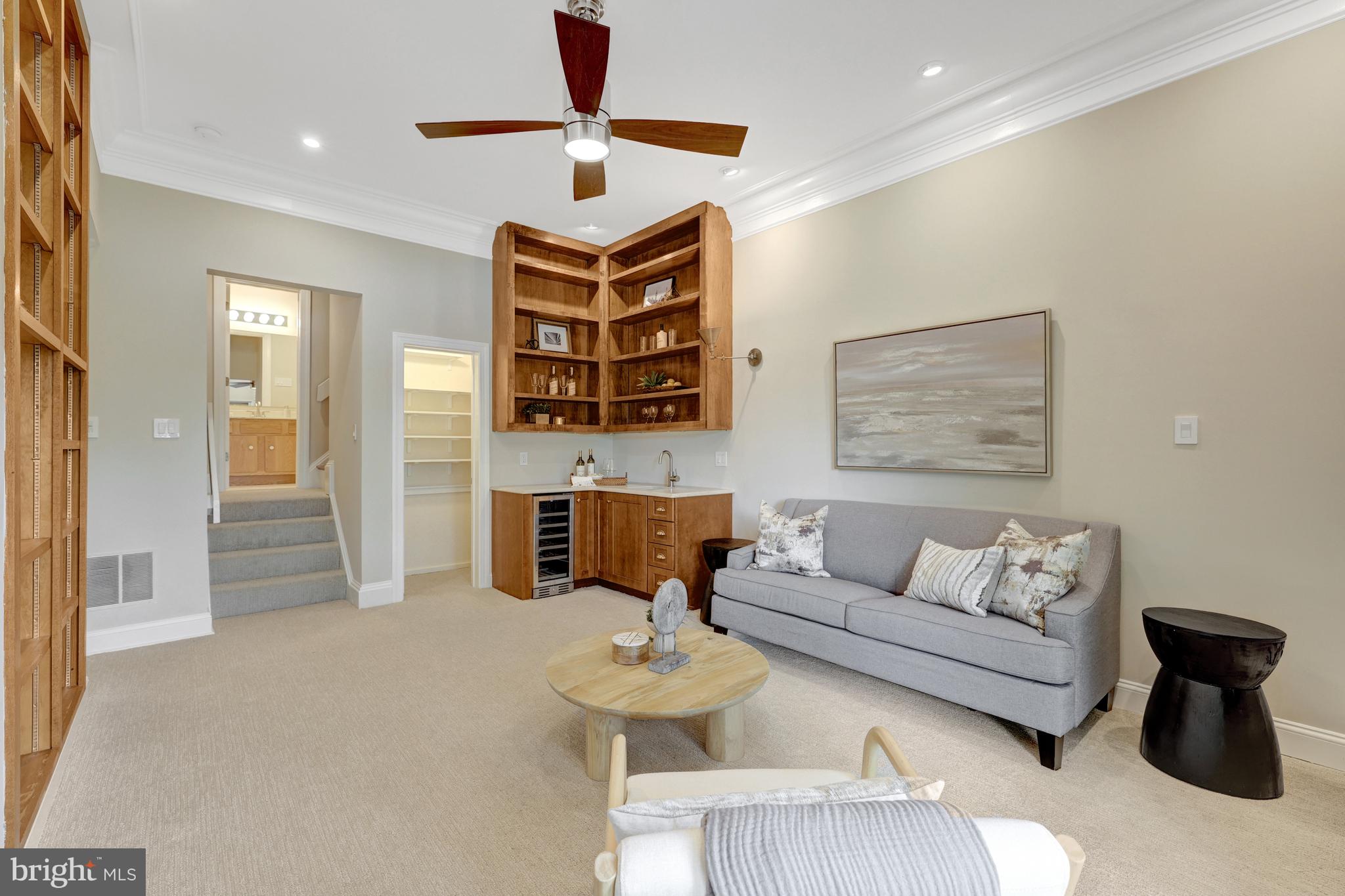 11064 Thrush Ridge Road Reston, VA 20191 - Photo 54 of 85 a living room with furniture and a chandelier