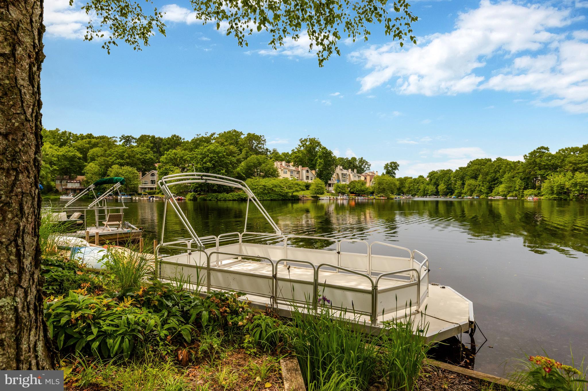 11064 Thrush Ridge Road Reston, VA 20191 - Photo 70 of 85 a view of a lake with a house in the background