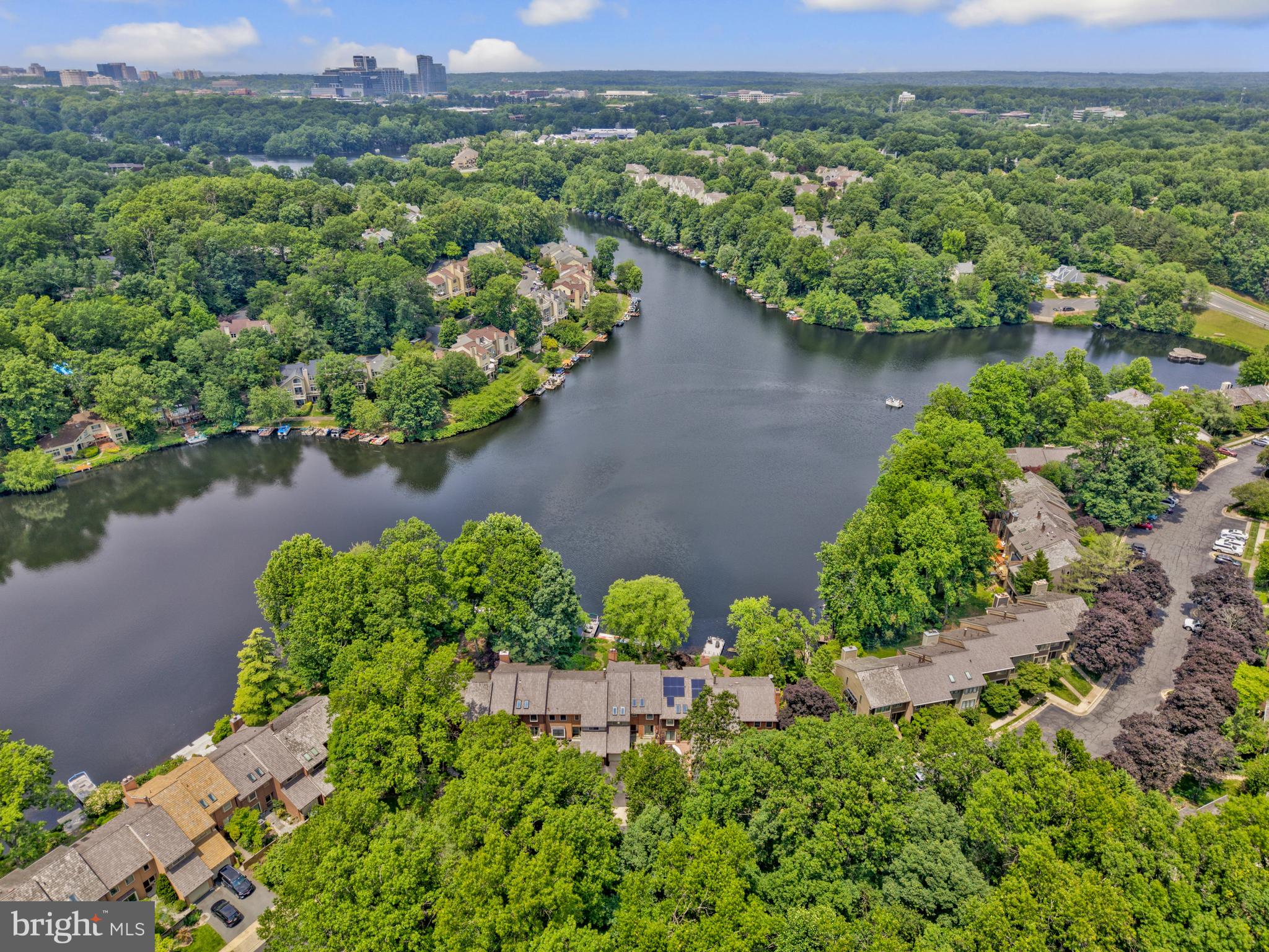 11064 Thrush Ridge Road Reston, VA 20191 - Photo 77 of 85 an aerial view of a house with a yard and lake view