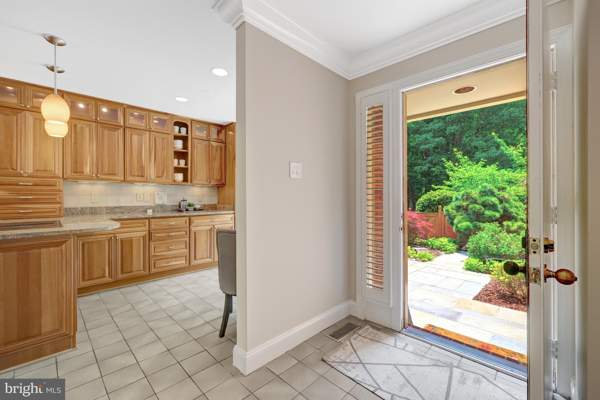 11064 Thrush Ridge Road Reston, VA 20191 - Photo 8 of 85 Front foyer opens to the table space kitchen.