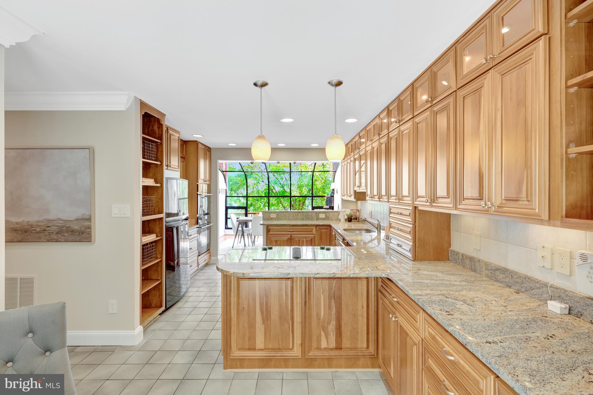 11064 Thrush Ridge Road Reston, VA 20191 - Photo 9 of 85 a kitchen with stainless steel appliances granite countertop a sink and a stove