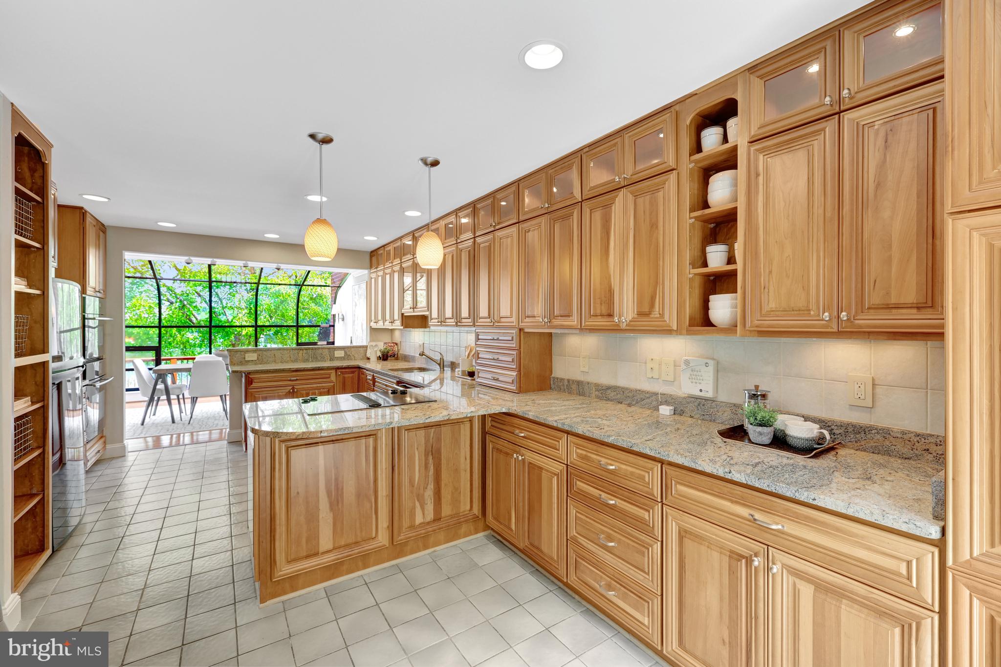 11064 Thrush Ridge Road Reston, VA 20191 - Photo 10 of 85 Table space kitchen featuring cherry cabinetry!