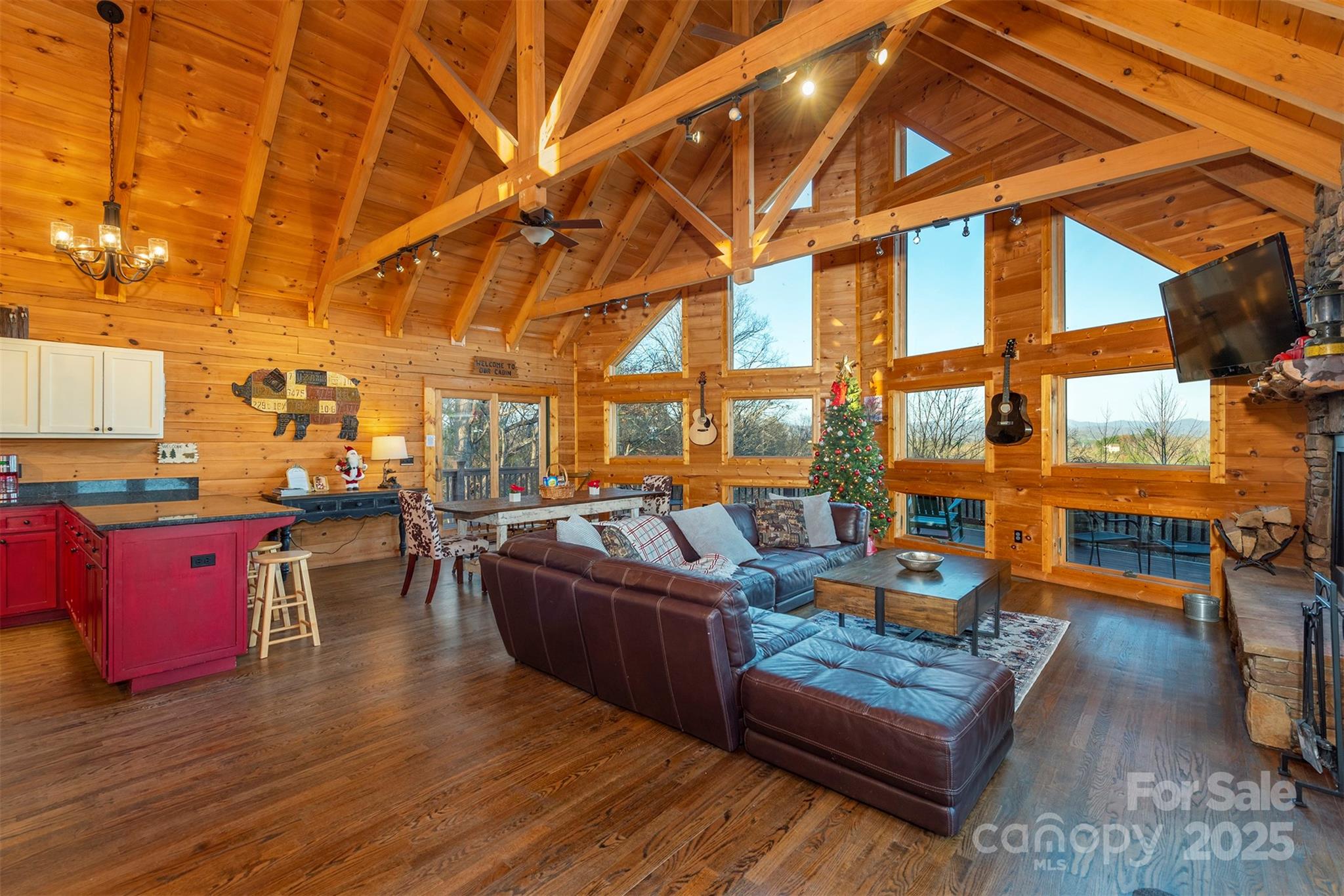 395 Dry Pond Road Marshall, NC 28753 - Photo 20 of 47 a living room with patio furniture and a fireplace