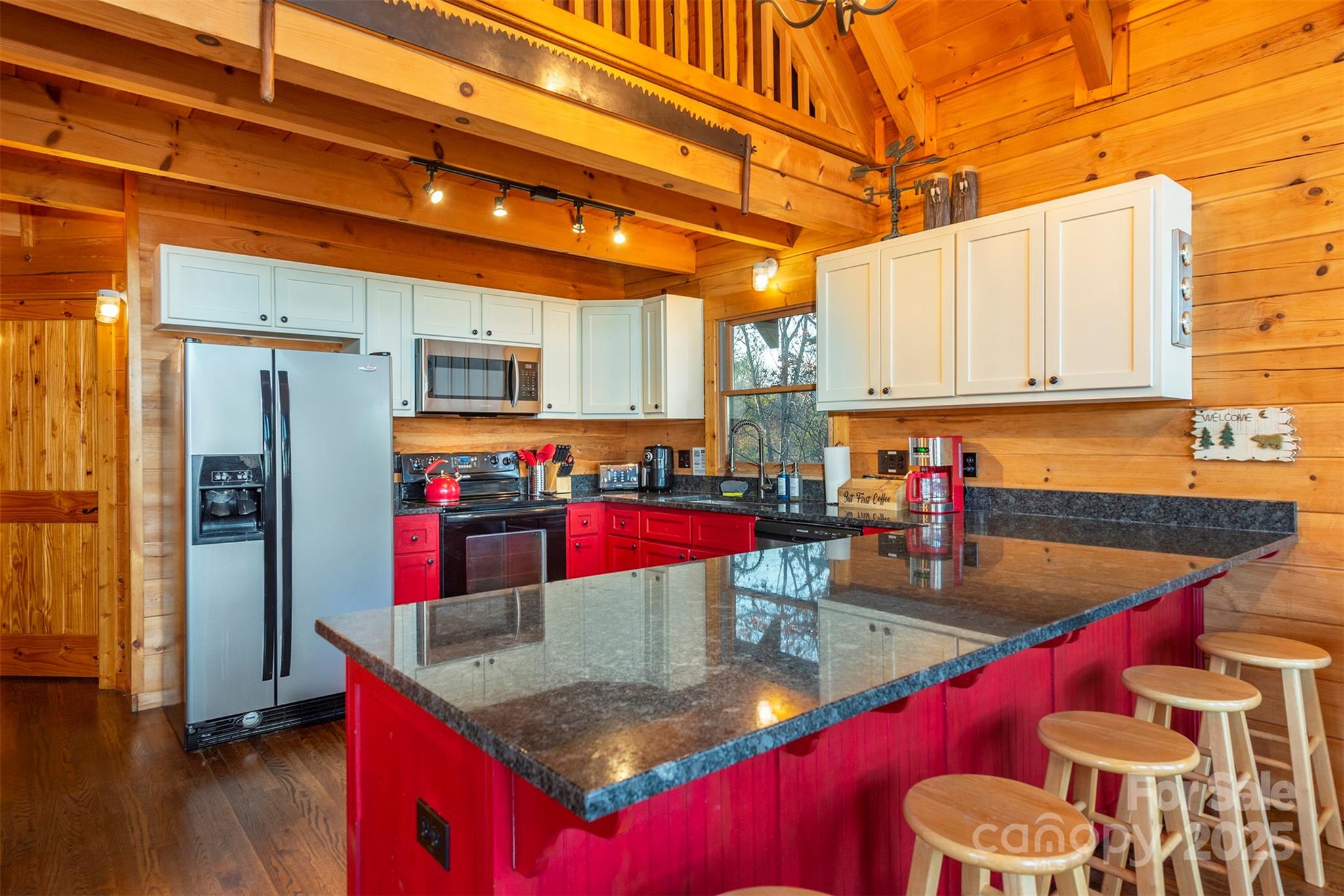395 Dry Pond Road Marshall, NC 28753 - Photo 21 of 47 a kitchen with refrigerator and stove