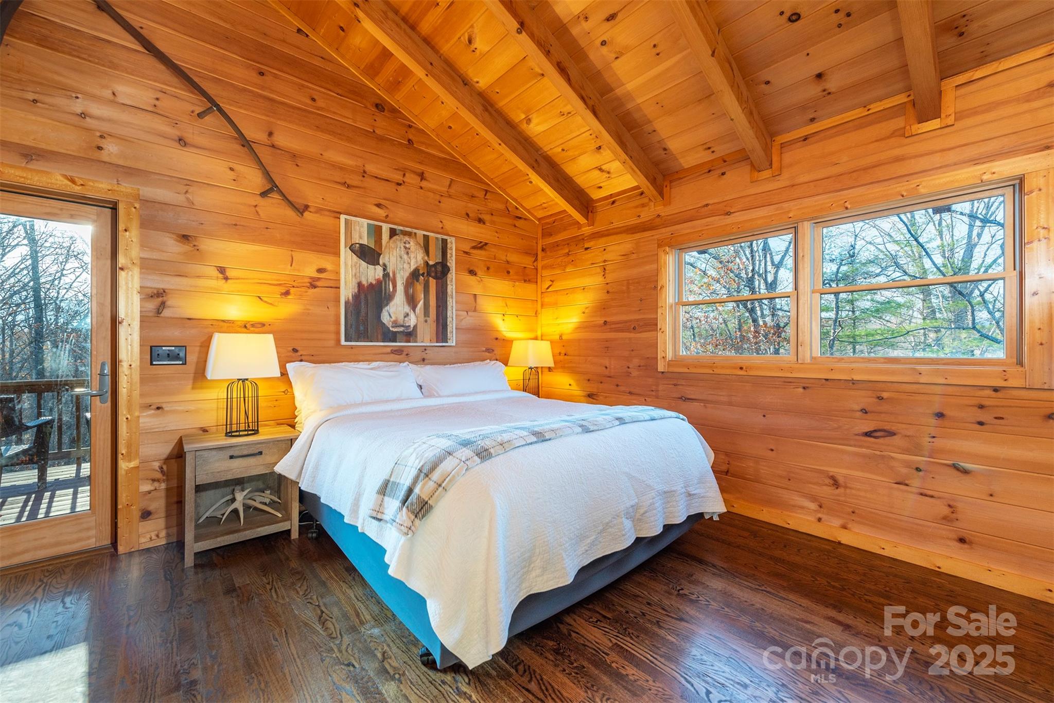 395 Dry Pond Road Marshall, NC 28753 - Photo 25 of 47 a bedroom with a bed and wooden floor