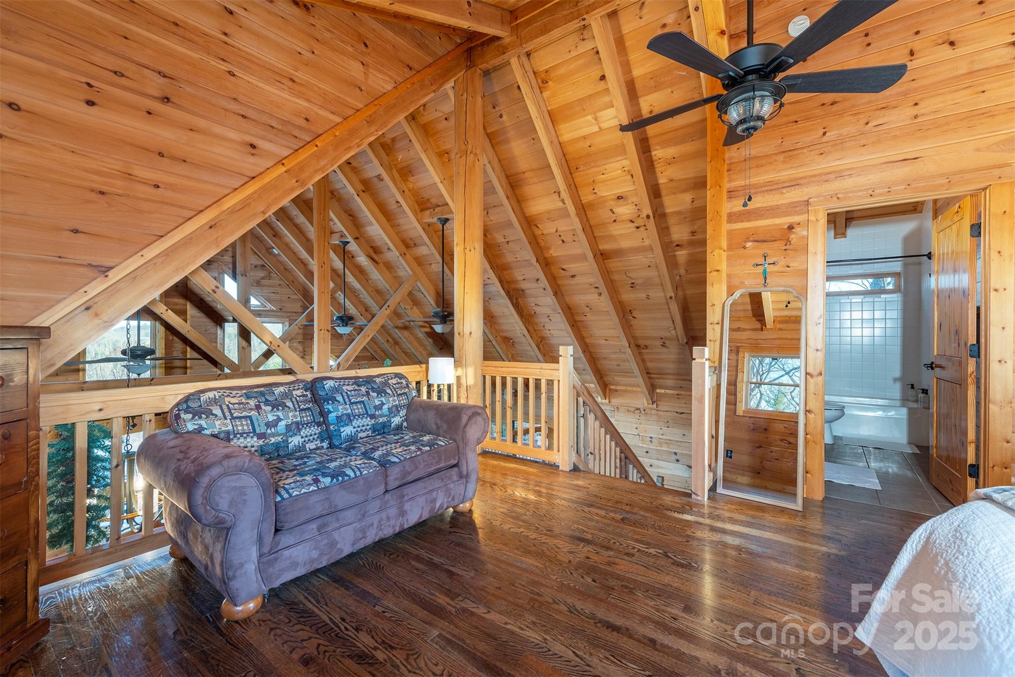 395 Dry Pond Road Marshall, NC 28753 - Photo 26 of 47 a living room with couch and wooden floor