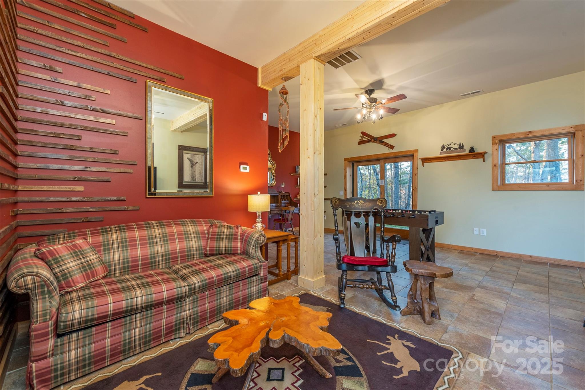 395 Dry Pond Road Marshall, NC 28753 - Photo 27 of 47 a bedroom with furniture and a chandelier