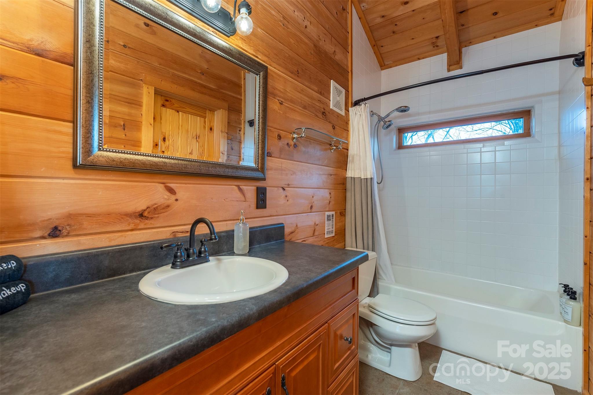 395 Dry Pond Road Marshall, NC 28753 - Photo 35 of 47 a bathroom with a sink and a mirror