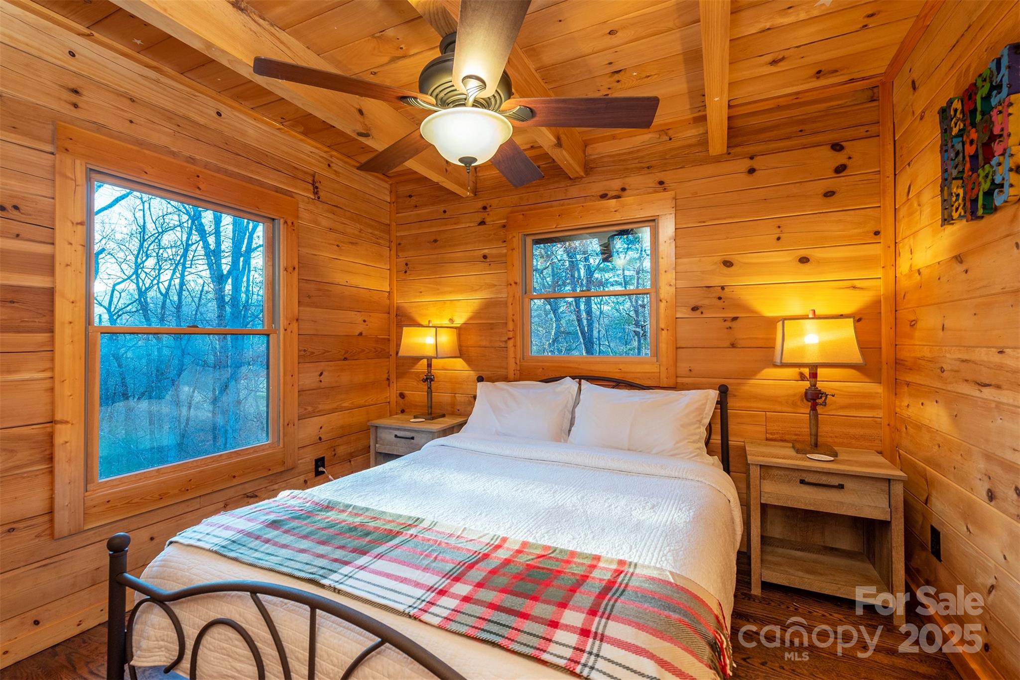 395 Dry Pond Road Marshall, NC 28753 - Photo 36 of 47 a bedroom with a bed and wooden floor