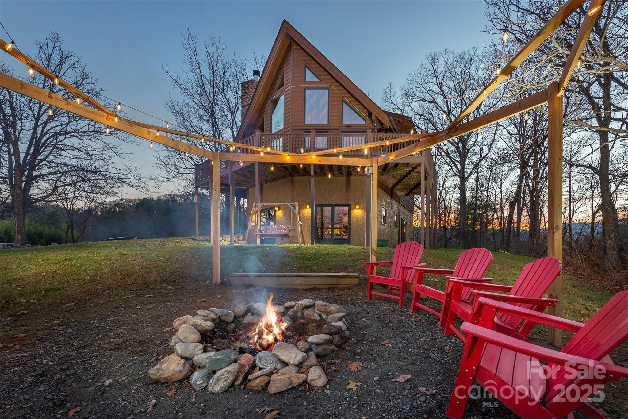 395 Dry Pond Road Marshall, NC 28753 - Photo 4 of 47 a backyard of a house with outdoor seating