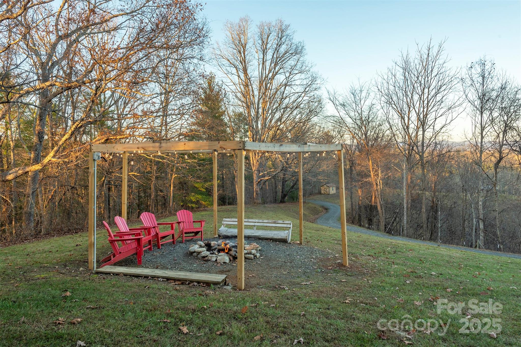 395 Dry Pond Road Marshall, NC 28753 - Photo 5 of 47 a view of a park with large trees and a slide