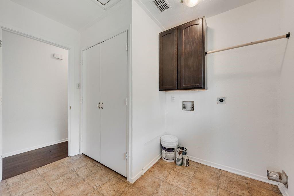 301 Lipscomb Street Cleburne, TX 76031 - Photo 9 of 21 a bathroom with a sink and a mirror