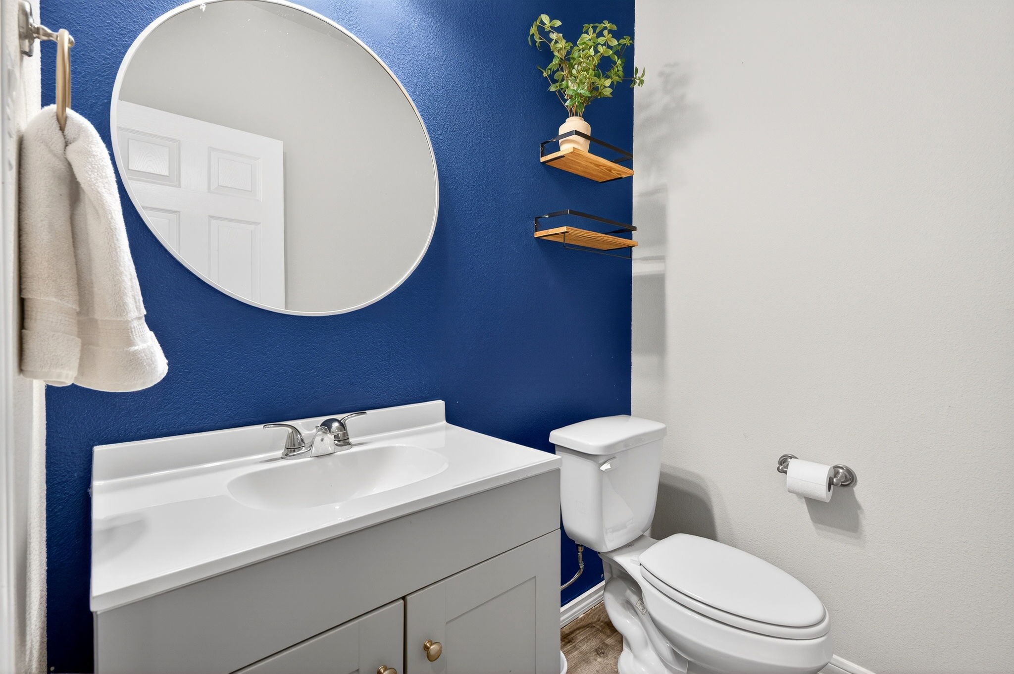 2121 Cedar Way Drive Conroe, TX 77301 - Photo 16 of 27 a bathroom with a toilet sink and mirror