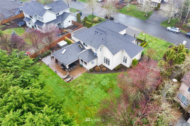 an aerial view of residential house with outdoor space and parking