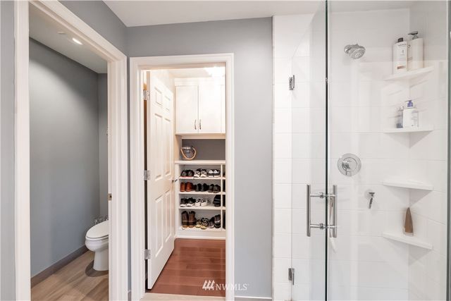 a bathroom with a shower toilet and sink