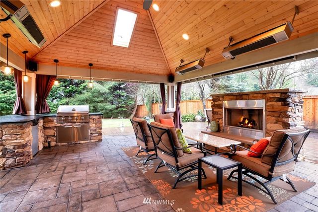 a view of a patio with a table and chairs