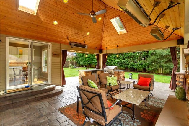 a patio with patio lots of furniture and outdoor seating