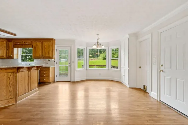 a view of a kitchen with a sink and a window