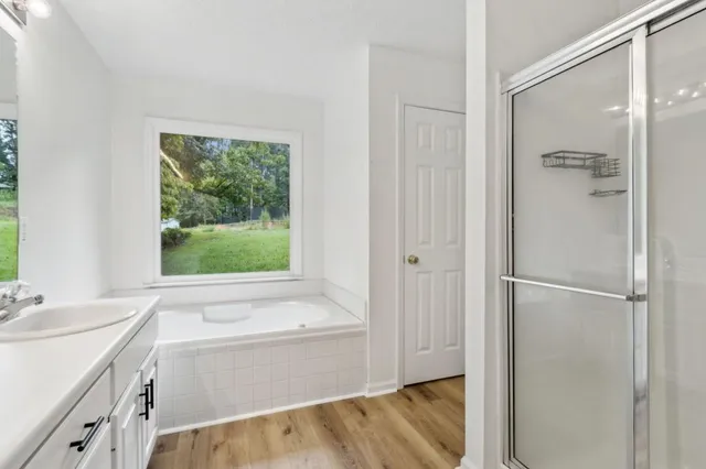 a bathroom with a bathtub and a sink