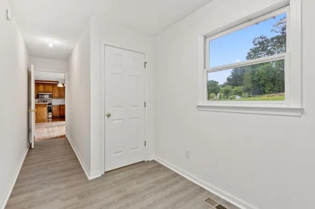 a view of a room with wooden walls