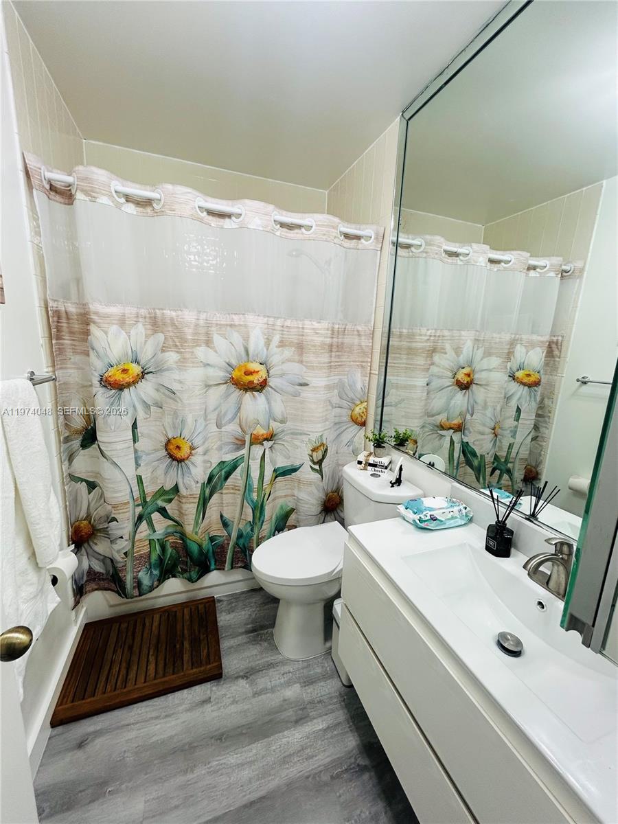 13890 Southwest 64th Street Miami, FL 33183 - Photo 12 of 23 a bathroom with a sink a toilet and shower