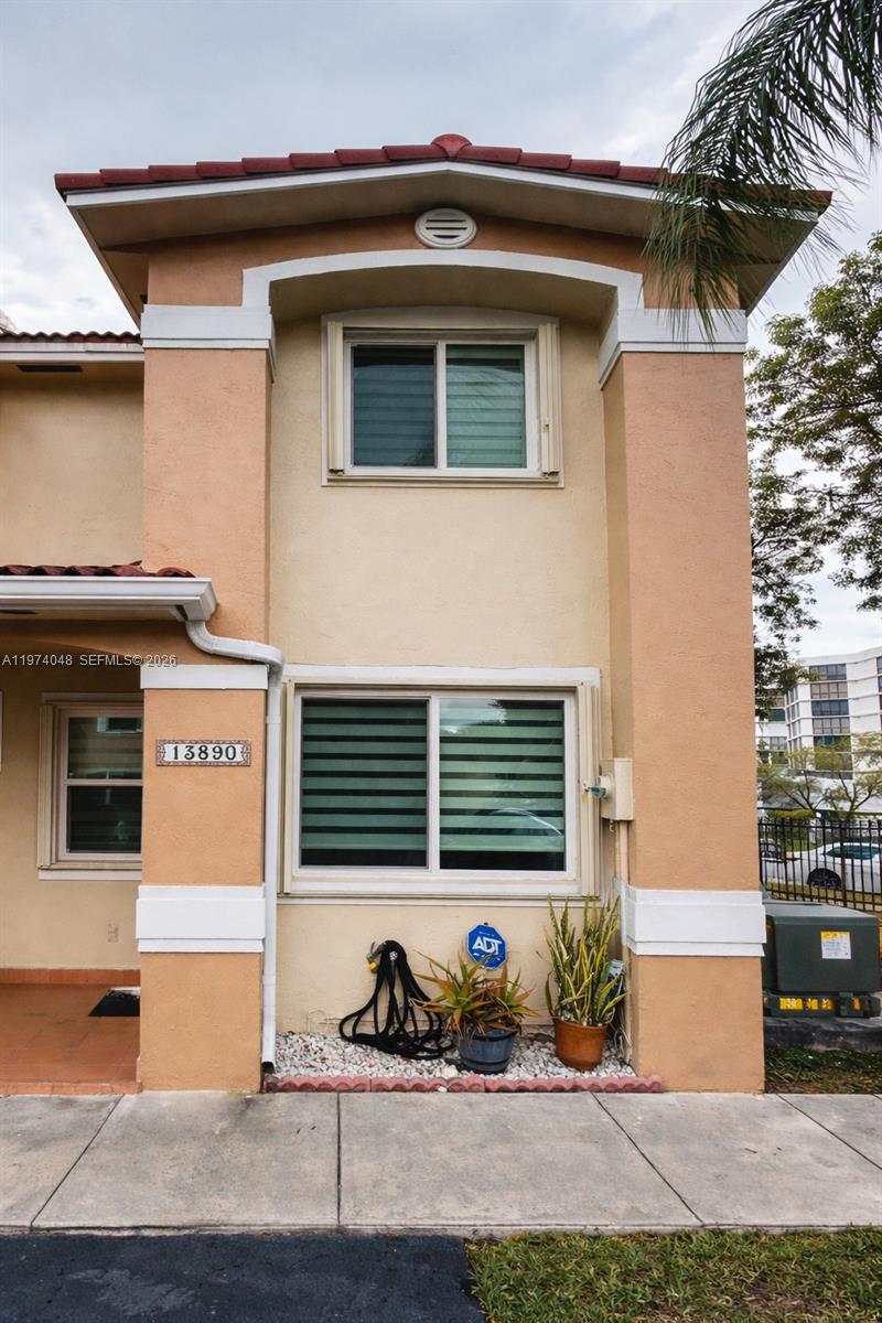 13890 Southwest 64th Street Miami, FL 33183 - Photo 17 of 23 a front view of a house with sitting area