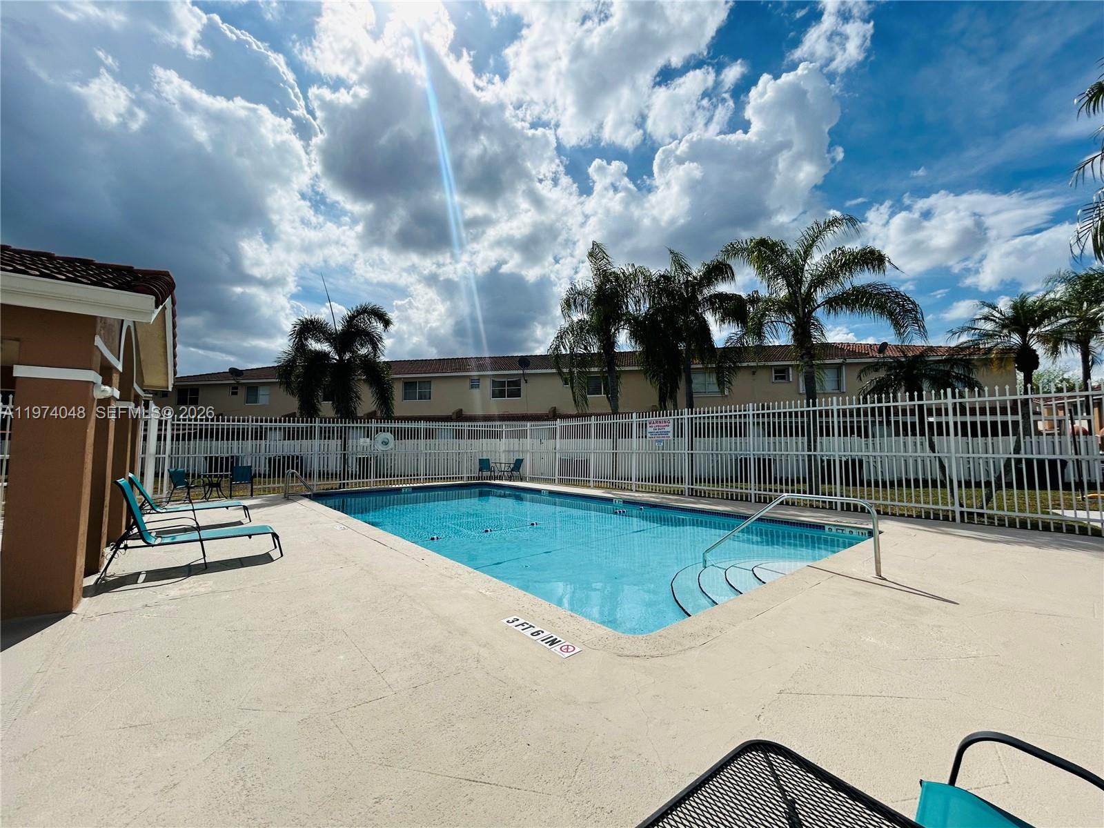 13890 Southwest 64th Street Miami, FL 33183 - Photo 20 of 23 a view of a swimming pool with a slide