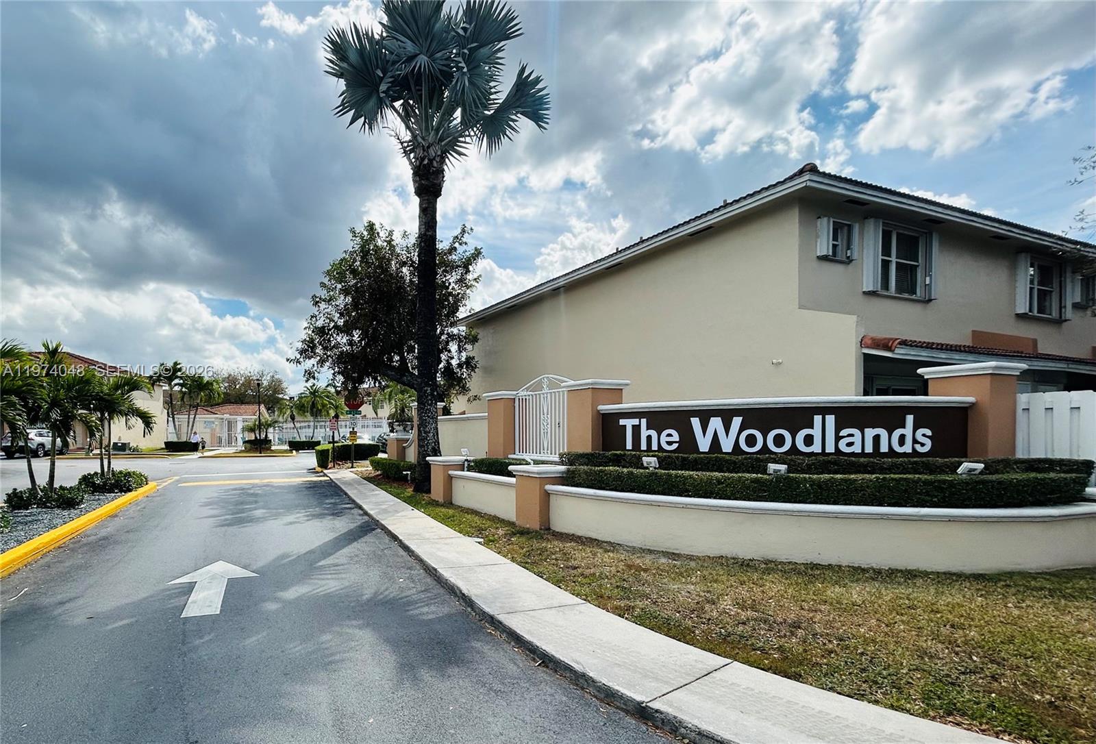 13890 Southwest 64th Street Miami, FL 33183 - Photo 22 of 23 a view of street with wooden fence