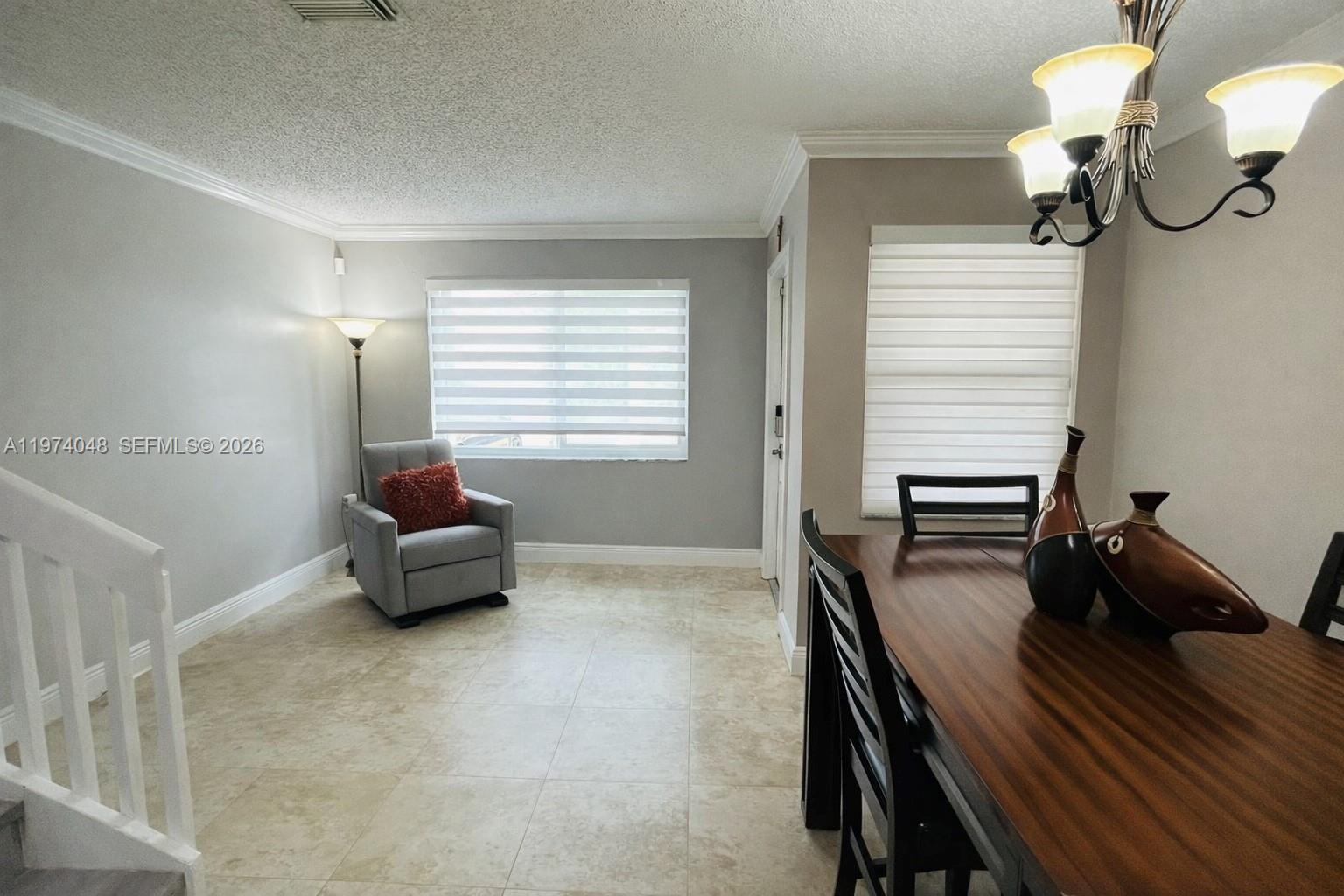 13890 Southwest 64th Street Miami, FL 33183 - Photo 8 of 23 a living room with furniture and a window
