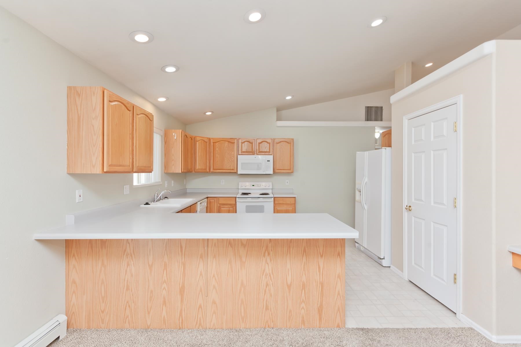 340 Elderberry Drive Fruita, CO 81521 - Photo 14 of 42 a view of kitchen with wooden floor
