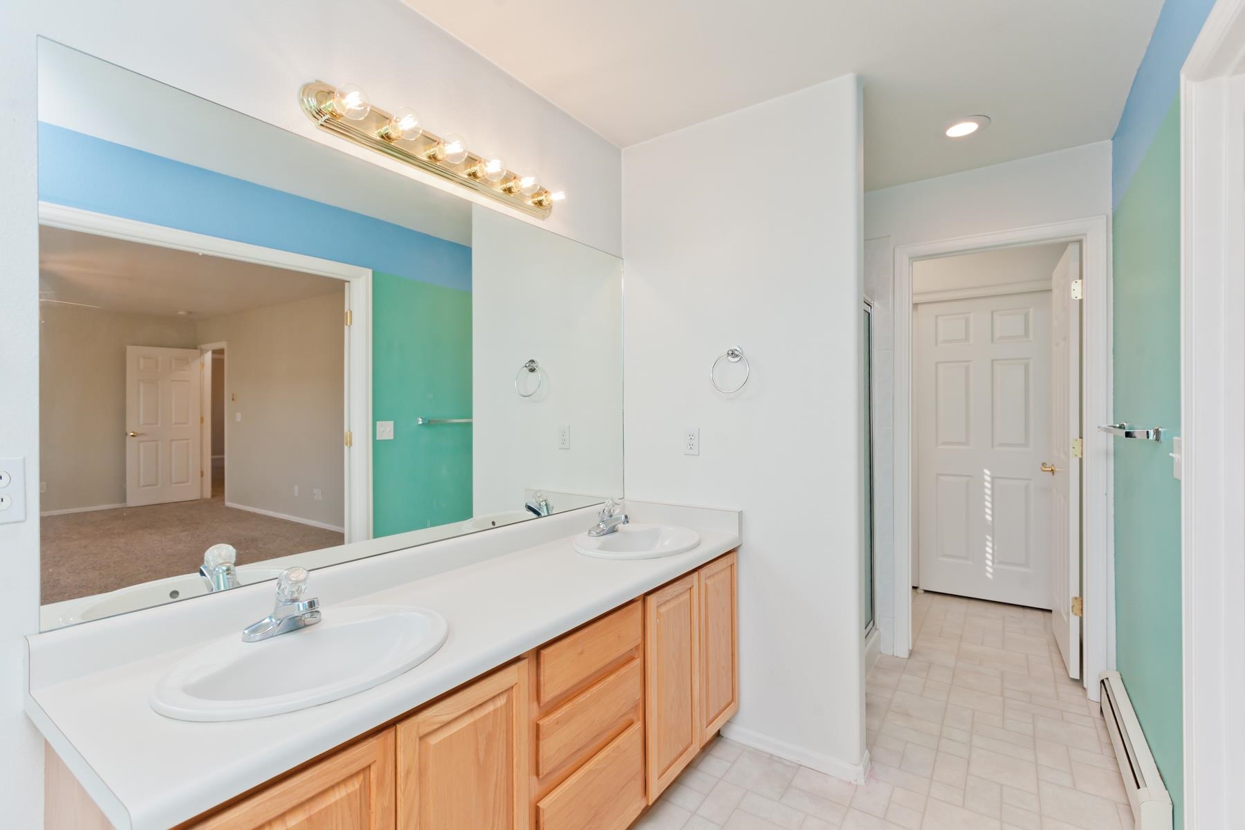 340 Elderberry Drive Fruita, CO 81521 - Photo 16 of 42 a bathroom with a sink vanity and a mirror