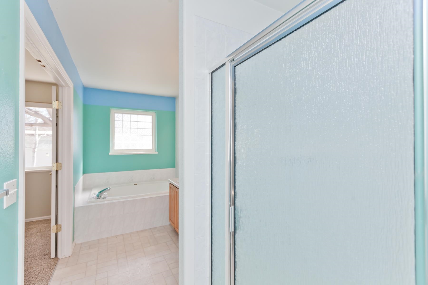 340 Elderberry Drive Fruita, CO 81521 - Photo 18 of 42 a bathroom with a bathtub and a shower