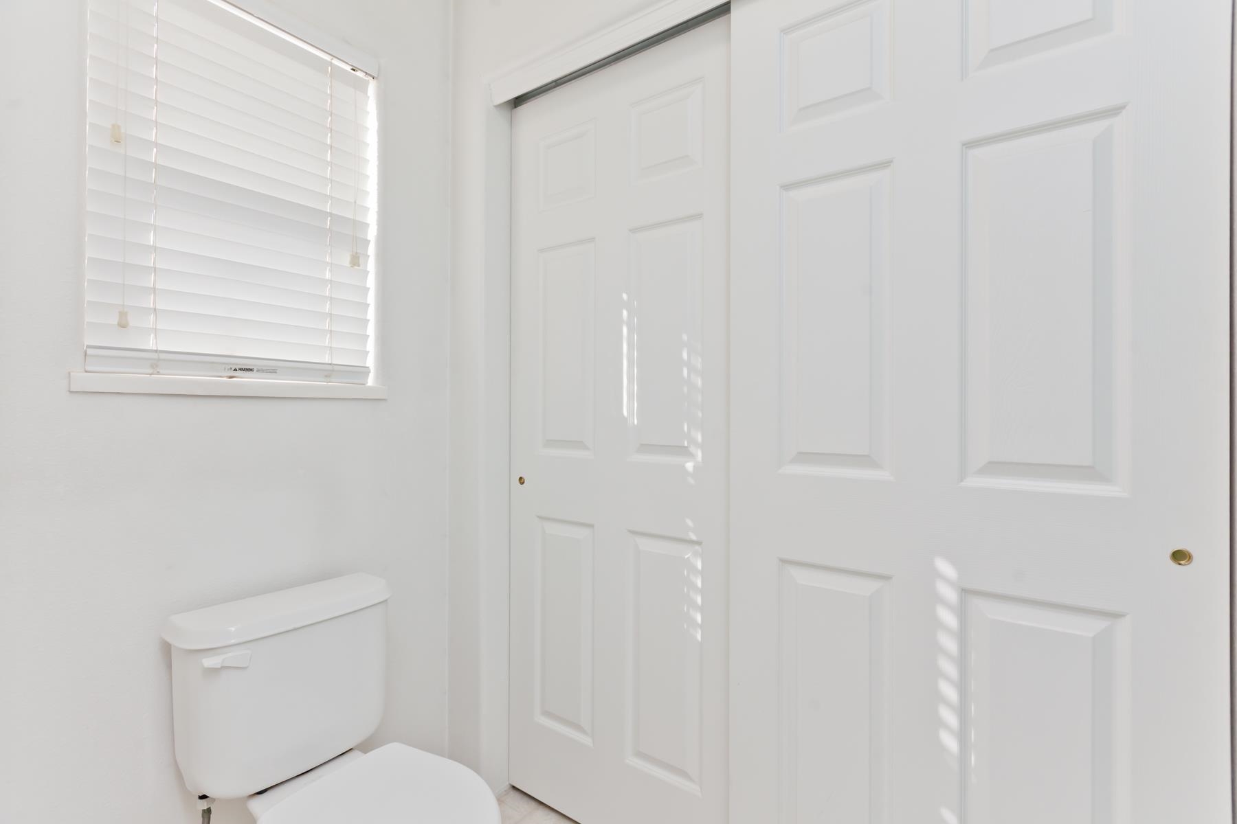 340 Elderberry Drive Fruita, CO 81521 - Photo 19 of 42 a white toilet sitting next to a bathroom sink