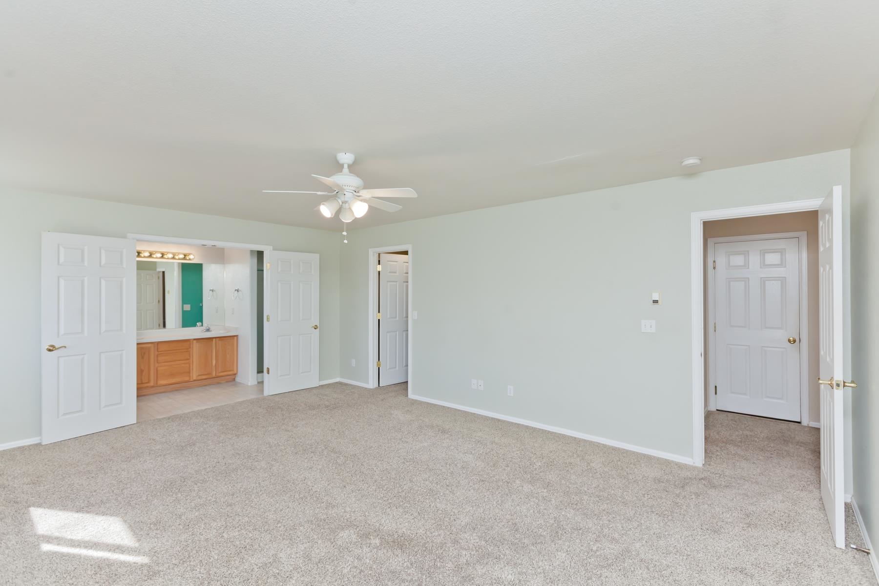 340 Elderberry Drive Fruita, CO 81521 - Photo 30 of 42 a view of an empty room with window and cabinet