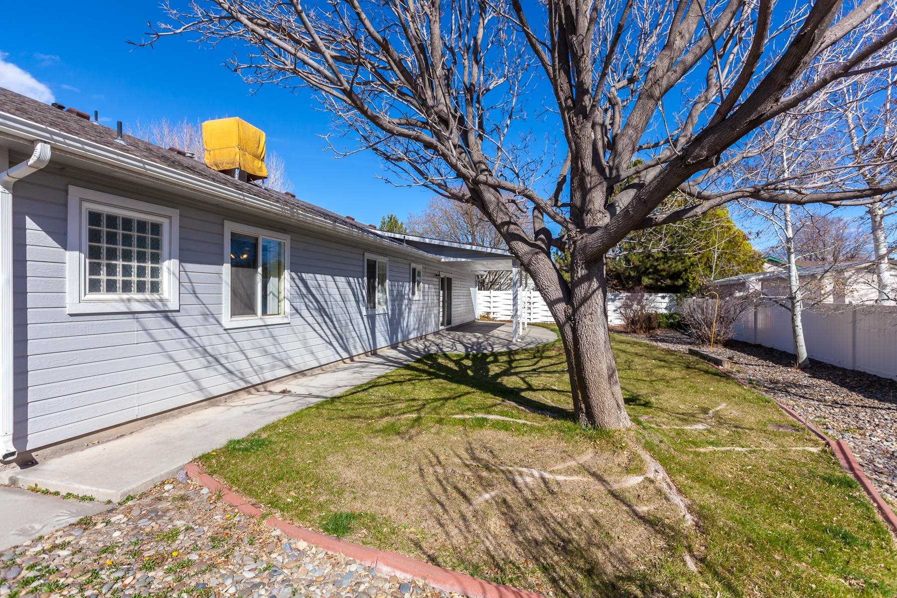 340 Elderberry Drive Fruita, CO 81521 - Photo 37 of 42 a view of a house with pool and sitting area
