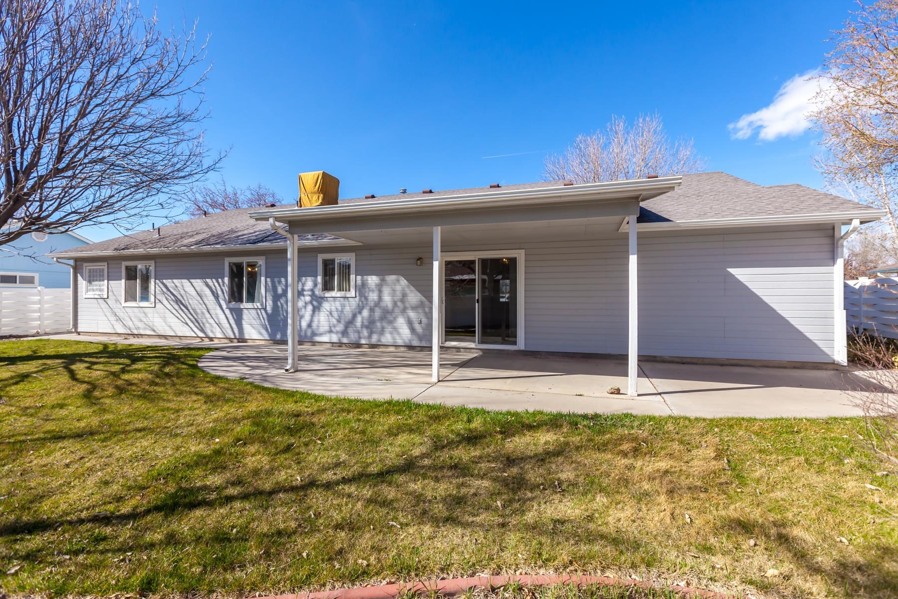 340 Elderberry Drive Fruita, CO 81521 - Photo 40 of 42 a view of a house with pool and chairs