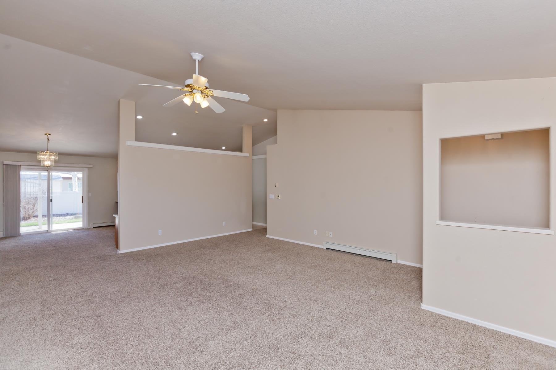 340 Elderberry Drive Fruita, CO 81521 - Photo 4 of 42 a view of a livingroom with a chandelier fan