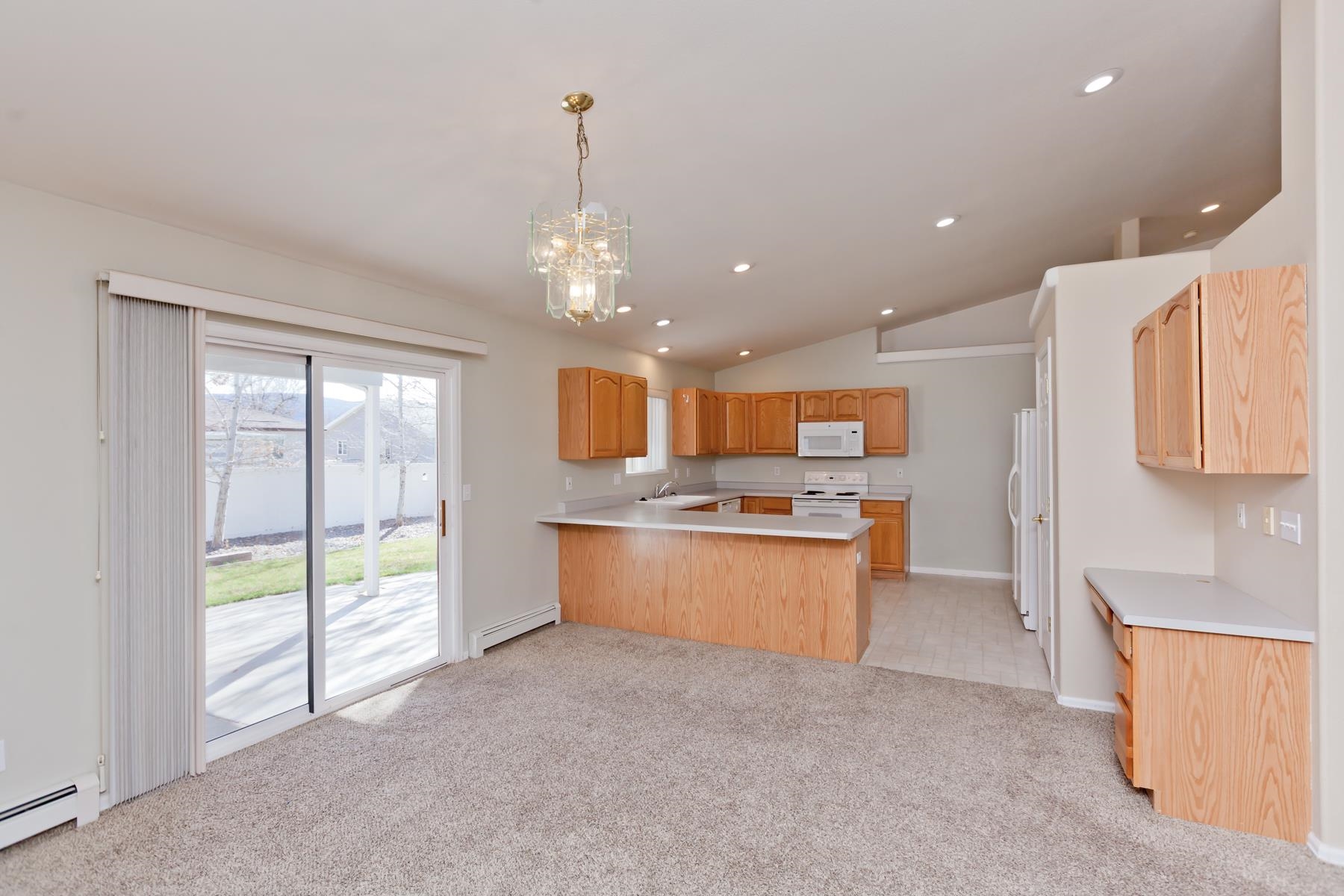 340 Elderberry Drive Fruita, CO 81521 - Photo 7 of 42 a large kitchen with stainless steel appliances lots of counter space and a sink