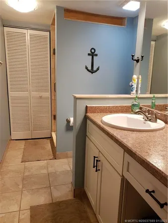 a bathroom with a sink and a mirror