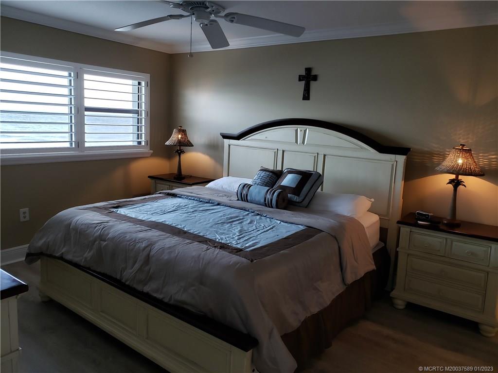 7440 South Ocean Drive, Unit 323A Jensen Beach, FL 34957 - Photo 8 of 12 a bedroom with a bed a window and dresser