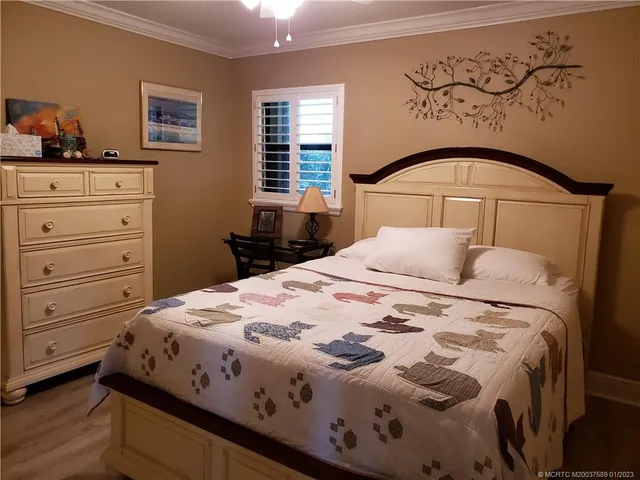 a bedroom with a bed and a dresser