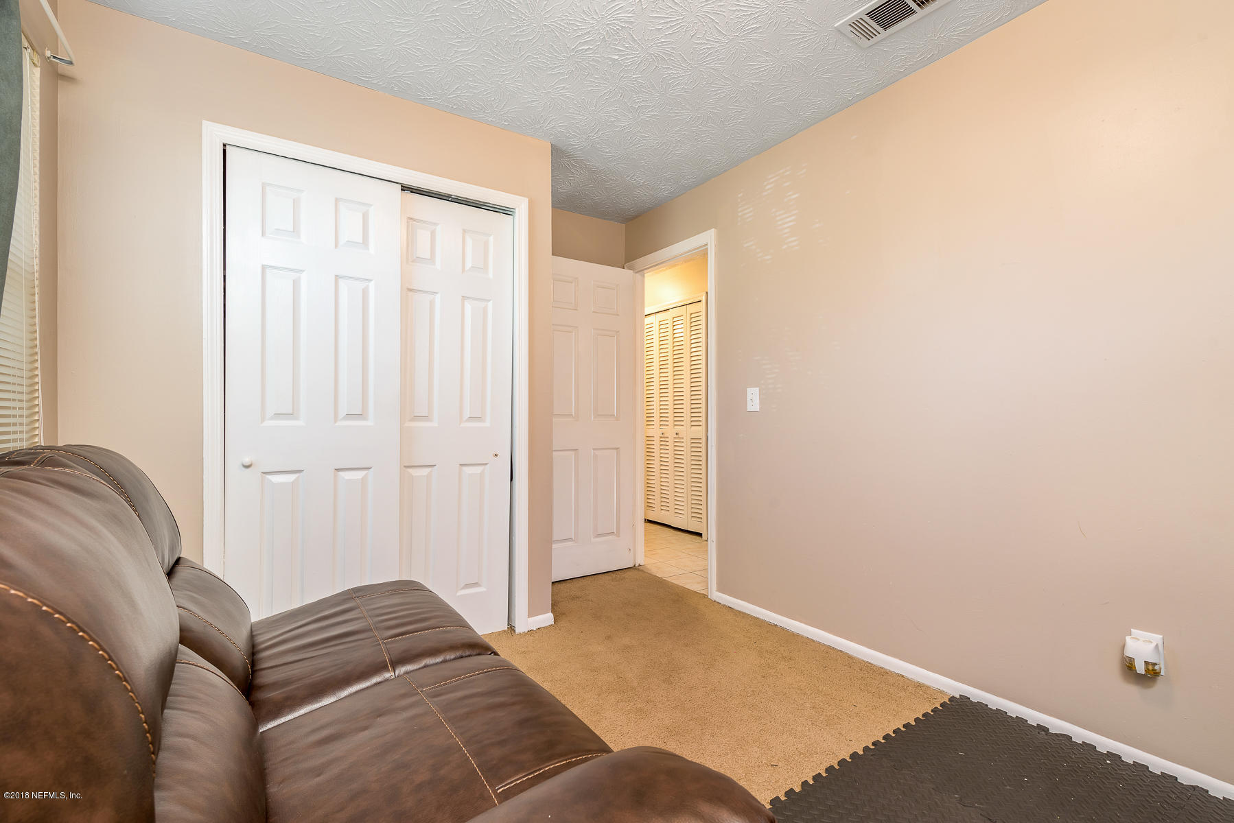 1005 Stokes Street Jacksonville, FL 32221 - Photo 14 of 20 thirdbedroomclosetviewtohall