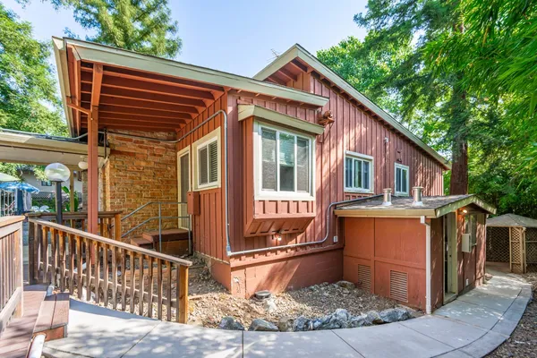 a front view of house with small garden