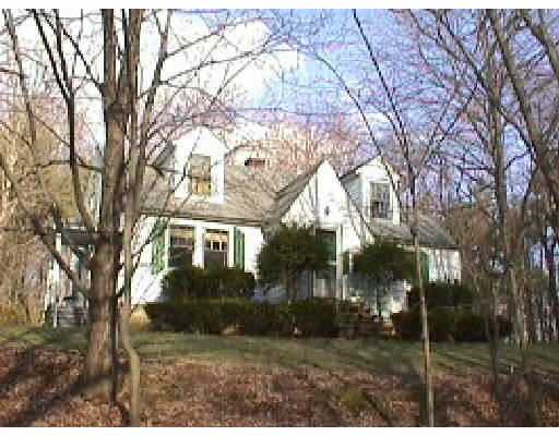 46 Arnold Road Sturbridge, MA 01518 - Photo 1 of 1 a view of house in middle of forest