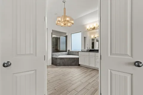 a large spacious bathroom with a double vanity sink and a mirror