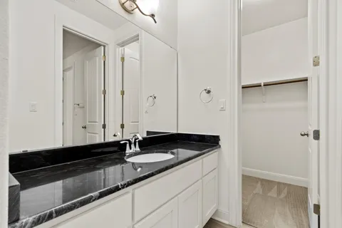 a bathroom with a toilet a sink and bathtub